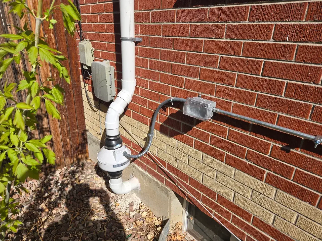 A PowerHouse radon mitigation system installed on a Colorado home