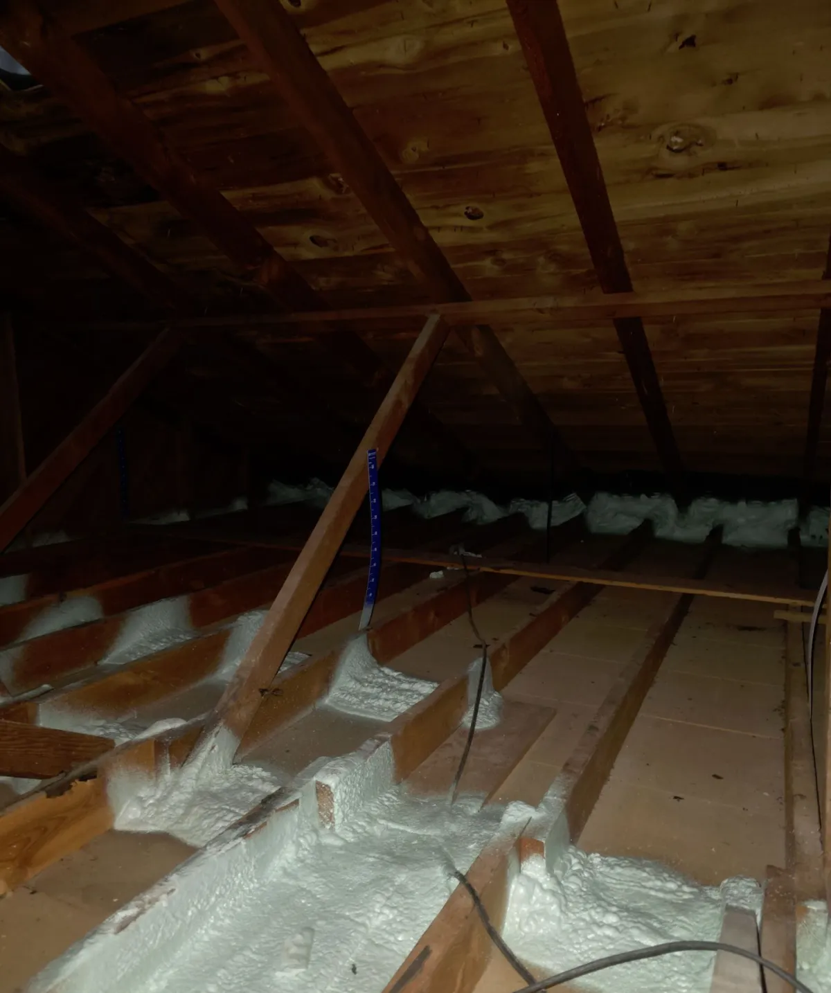 Attic top plates and wiring penetrations sealed with spray foam before insulation